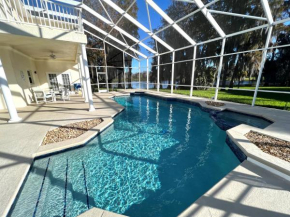 Mickeys Homestead - Stylish 4BR Lakefront Cottage with Huge South Facing Pool Hot Tub BBQ - 2 miles Disney!